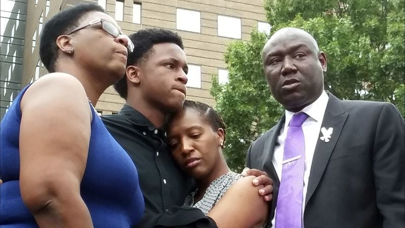 Allison Jean and her children, Brandt Jean and Allisa Charles-Findley, are pictured with attorney Ben Crump, far right, last year. Jean's son, Botham Jean, was fatally shot Sept. 6, 2018, by Amber Guyger, a neighbor and off-duty police officer.