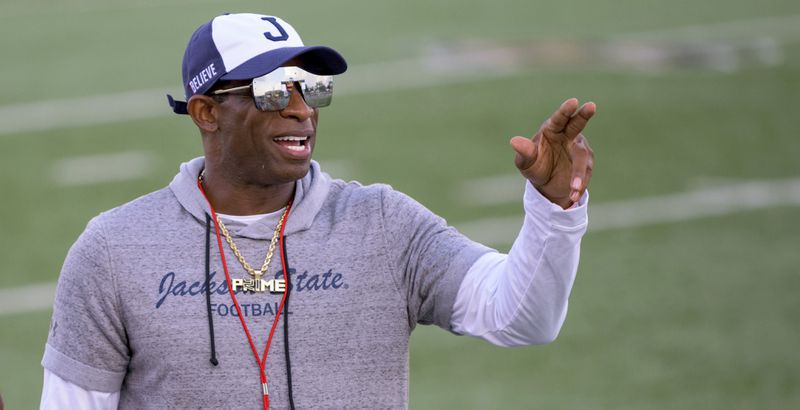 Jackson State head coach Deion Sanders points during an NCAA football game against Louisiana Monroe on Saturday, Sept. 18, 2021, in Monroe, La. Deion Sanders has been all over national TV, putting Jackson State in the spotlight every time his insurance commercials air.