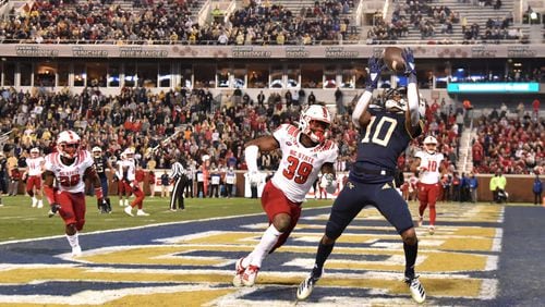 Georgia Tech wide receiver Ahmarean Brown (10) makes a touchdown catch over North Carolina State defensive back Jakeen Harris (39) during the first half of an NCAA college football game at Bobby Dodd Stadium on Thursday, November 21, 2019. (Hyosub Shin / Hyosub.Shin@ajc.com)