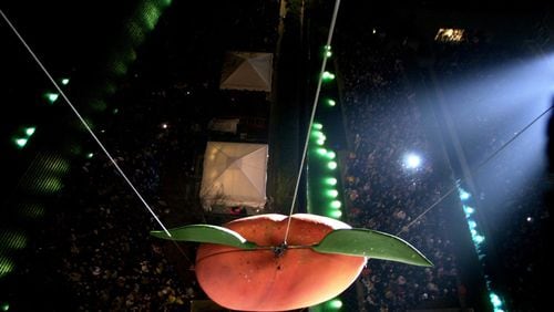 The Peach Drop at Underground Atlanta has been an Atlanta tradition since 1989. The peach is eight feet tall, weighs 800 pounds and takes 53 seconds to makes its way down the tower. Atlanta Journal-Constitution archive image by Ben Gray