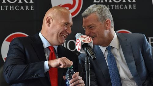 New Hawks GM Travis Schlenk (left) and Hawks principal owner Tony Ressler share a laugh before the press conference to officially introduce new general manager Travis Schlenk at Philips Arena on Friday, June 2, 2017. HYOSUB SHIN / HSHIN@AJC.COM