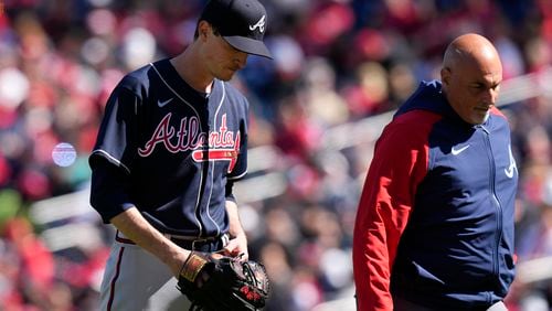 Atlanta Braves starting pitcher Max Fried, left, walks off the field during the fourth inning of an opening day baseball game against the Washington Nationals at Nationals Park, Thursday, March 30, 2023, in Washington. (AP Photo/Alex Brandon)