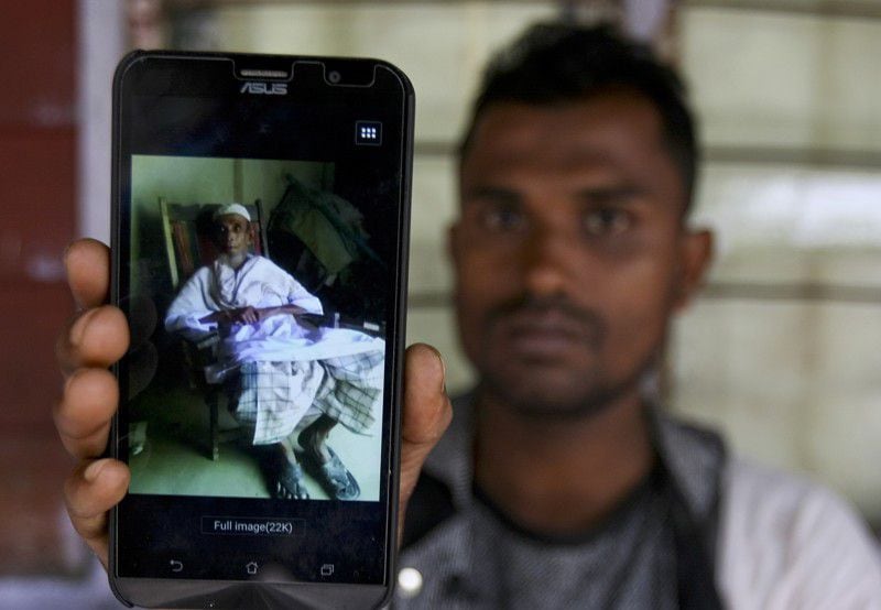 n this Tuesday, Sept. 12, 2017, photo, Rohingya refugee Muhammad Ayub shows off a picture of his grandfather allegedly killed during recent violence in Myanmar, in Klang on the outskirts of Kuala Lumpur, Malaysia. Recent violence in Myanmar has driven hundreds of thousands of Rohingya Muslims to seek refuge across the border in Bangladesh. There are some 56,000 Rohingya refugees registered with the U.N. refugee agency in Malaysia, with an estimated 40,000 more whose status has yet to be assessed.