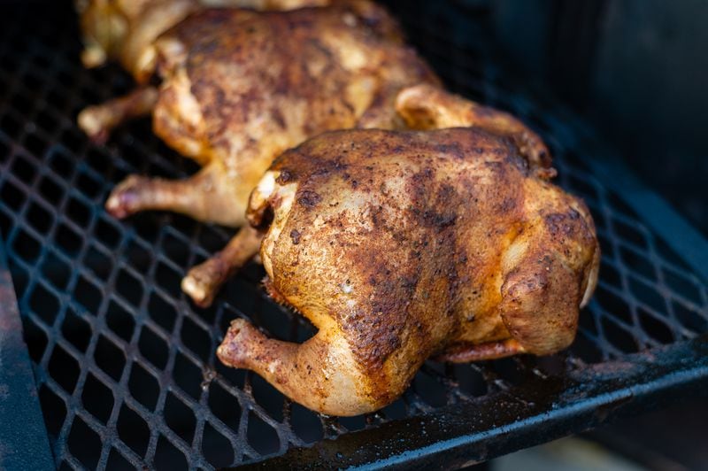 For dinner at Atlanta Fire Station 4, Lt. Ryan Sims injected three chickens  with a Cajun butter marinade before smoking them.