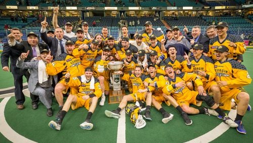 The Georgia Swarm celebrate winning the National Lacrosse League championship Saturday night in the SaskTel Centre in Saskatoon, Saskatchewan, on Saturday night. Miles Thompson scored the game-winner in overtime for a 15-14 victory over the Saskatchewan Rush as the Swarm took the best-of-three series 2-0. (PHOTO CREDIT: Josh Schaefer/GetMyPhoto.ca)
