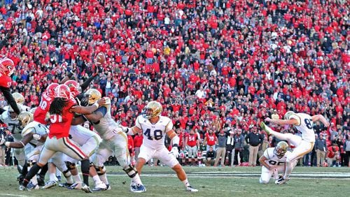 Perhaps the crowning moment of Harrison Butker’s Georgia Tech career, his 53-yard field goal to force overtime against Georgia in 2014. (AJC photo by Hyosub Shin)