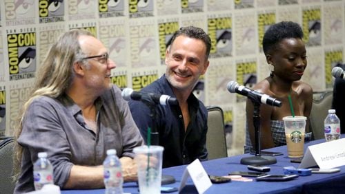 SAN DIEGO, CA - JULY 20:  (L-R) Greg Nicotero, Andrew Lincoln, and Danai Gurira speak at The Walking Dead Press Conference during Comic Con 2018 on July 20, 2018 in San Diego, California.  (Photo by Jesse Grant/Getty Images for AMC)