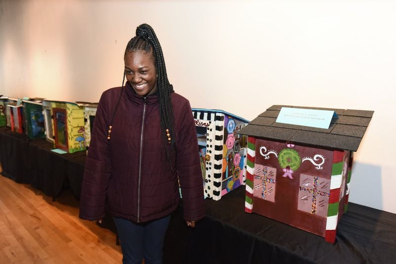 Brianna Cash from South Gwinnett High School reacts as she shows off her library (right) at G.R.E.A.T. Little Minds Exhibition at The Hudgens Center for Art & Learning in Duluth on Saturday, February 8, 2020. She chose a gingerbread house theme because she started the project around Christmas time. She said she wants to be a doctor, but art will always be a part of her life. (Photo: Hyosub Shin / Hyosub.Shin@ajc.com)