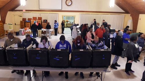 A steady stream of DeKalb County voters go to the polls on Election Day at Crossroads Presbyterian Church. KENT D. JOHNSON / KDJOHNSON@AJC.com