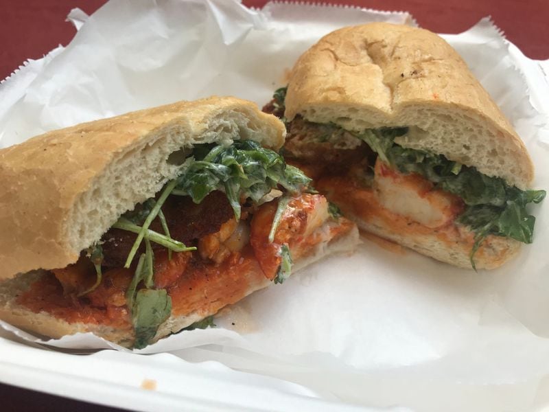 The Buffalo shrimp sandwich from Pea Ridge offers excellent heat. LIGAYA FIGUERAS / LIGAYA.FIGUERAS@AJC.COM