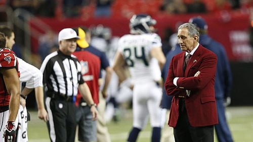 Atlanta Falcons team owner Arthur Blank stands on the field before the first half of the NFC divisional playoff NFL football game against the Seattle Seahawks, Sunday, Jan. 13, 2013, in Atlanta.