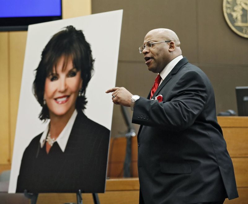 4/17/18 - Atlanta - Chief Assistant District Attorney Clint Rucker, with a photo of Diane McIver behind him, makes closing arguments for the prosecution today during the Tex McIver murder trial at the Fulton County Courthouse. Bob Andres bandres@ajc.com