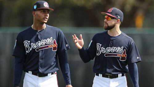 Ender Inciarte (right) gives some tips to Cristian Pache during a workout this week at Braves spring training in Lake Buena Vista, Fla. Curtis Compton/ccompton@ajc.com