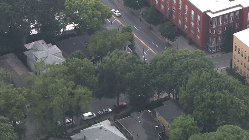 Police investigate after a man was found dead from a gunshot wound to the head inside his Midtown residence July 30. (Credit: Channel 2 Action News)