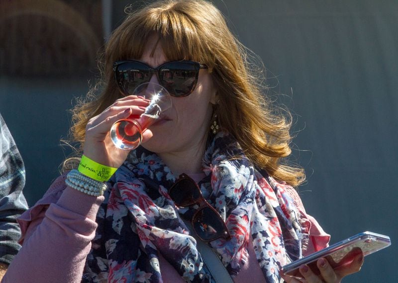 Kristyne Davis takes a sip of her beer during the Beer Bourbon & BBQ Festival at Atlantic Station Saturday, March 3, 2018.  STEVE SCHAEFER / SPECIAL TO THE AJC