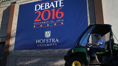 HEMPSTEAD, NY - SEPTEMBER 24: A debate sign hangs on a wall outside the media center setup for the first U.S. presidential debate at Hofstra University on September 24, 2016 in Hempstead, New York. Democratic presidential candidate Hillary Clinton is scheduled to debate Republican presidential candidate Donald Trump on September 26. (Photo by Joe Raedle/Getty Images)