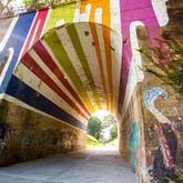 The Highball Artist is a mural created by Hadley Breckenridge on the tunnel that runs under Lucille Street is on the Westside Trail of the Beltline. (Jenni Girtman / Atlanta Event Photography)
