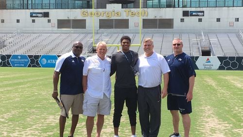 Chico Bennett of Franklin, Tenn., announced his commitment to Georgia Tech June 23, selecting the Yellow Jackets over Tennessee and Virginia. He posed for a picture on an unofficial visit to Tech in May with (from left to right) associate director of player personnel Thomas Balkcom, inside linebackers coach Andy McCollum, defensive coordinator Nate Woody and strength and conditioning coach John Sisk. (Courtesy Chico Bennett)