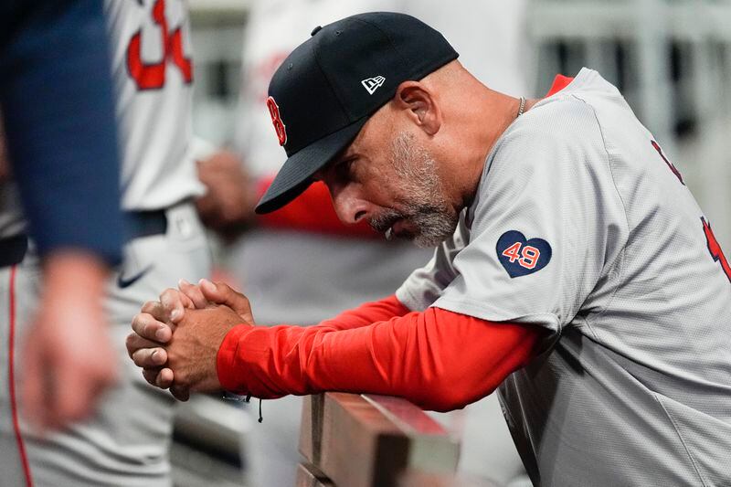 Boston Red Sox manager Alex Cora looks on from the dugout during in a baseball game against the Atlanta Braves Wednesday, May 8, 2024, in Atlanta. (AP Photo/John Bazemore)