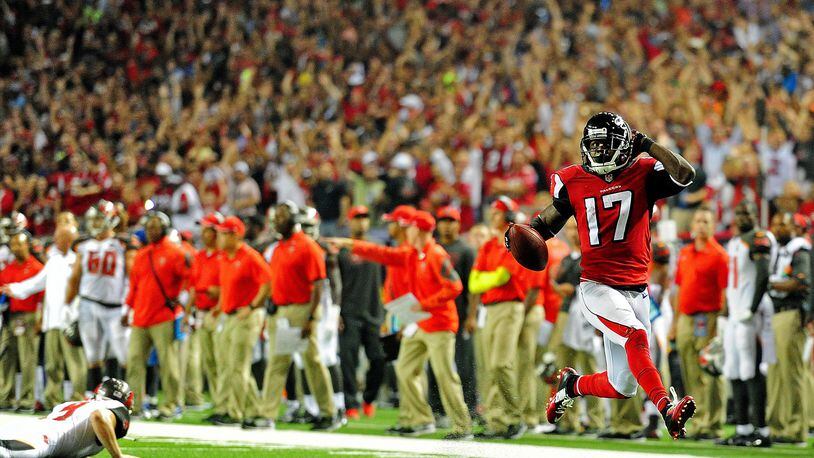 ATLANTA, GA - SEPTEMBER 18: Wide receiver Devin Hester #17 of the Atlanta Falcons returns a punt for a touchdown against the Tampa Bay Buccaneers during a game at the Georgia Dome on September 18, 2014 in Atlanta, Georgia. (Photo by Scott Cunningham/Getty Images)