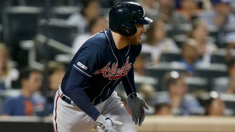 Braves first baseman Freddie Freeman follows through on a base hit in the third inning Saturday, Sept. 28, 2019, against the New York Mets at Citi Field in New York.