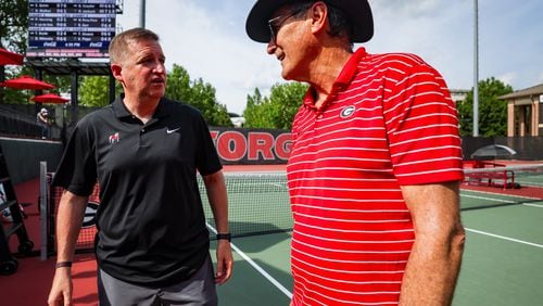 Georgia Athletic Director Josh Brooks (left) and head tennis coach Manuel Diaz after Georgia’s third round match of the 2023 NCAA Division I men’s tennis championships at Henry Feild Stadium inside the Dan Magill Tennis Complex in Athens, Ga., on Saturday, May 13, 2023. (Tony Walsh/UGAAA)