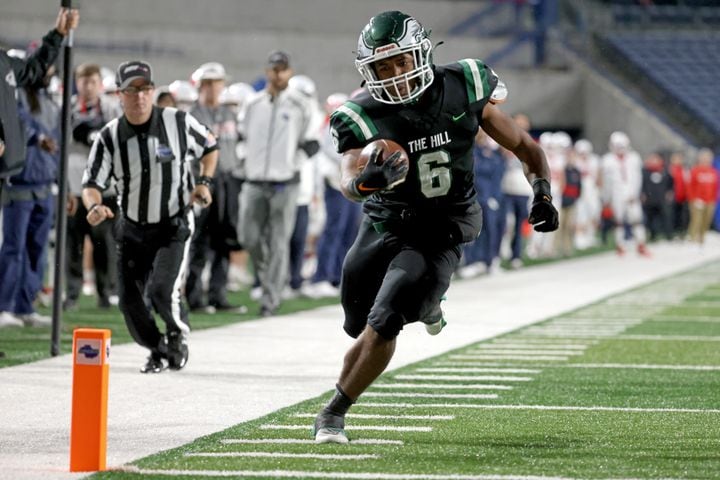 Collins Hill running back Spenser Anderson (6) scores a receiving touchdown against Milton during the first half of the Class 7A state title football game at Georgia State Center Parc Stadium Saturday, December 11, 2021, Atlanta. JASON GETZ FOR THE ATLANTA JOURNAL-CONSTITUTION