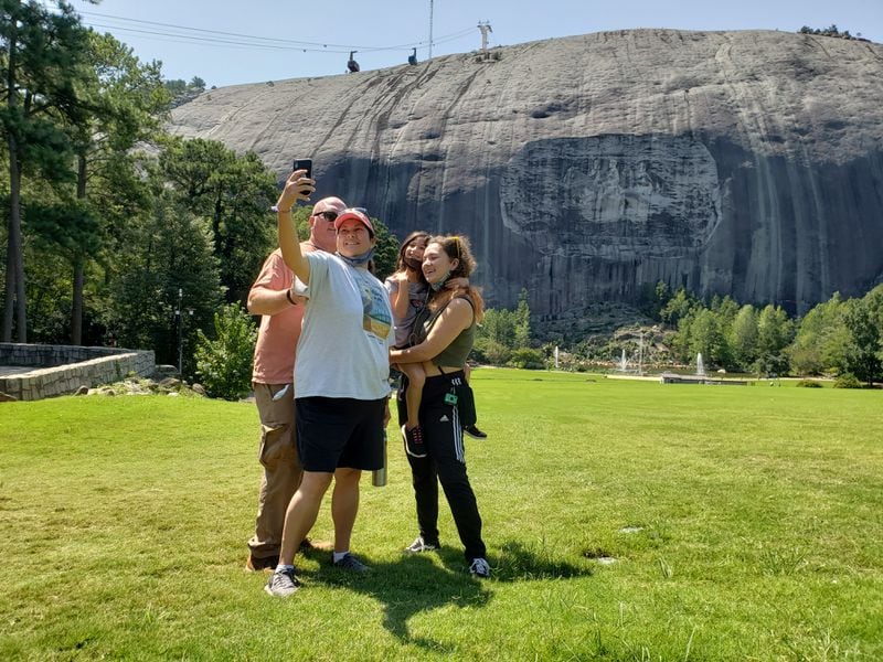 Lisa and Stephen Creswell, from Greenwood, South Carolina, stopped by Stone Mountain Park's Memorial Lawn for a selfie with their daughters on Sunday, September 6, 2020. (Photo: Matt Kempner/AJC)