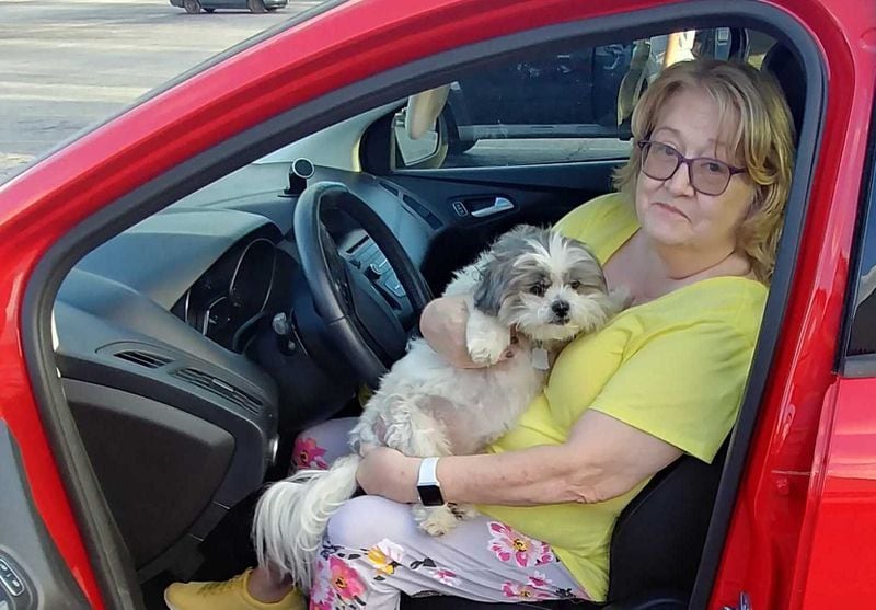 Mary Bryan, with her dog Muffy in an Ingles parking lot in Monticello on Nov. 9, 2020, said Donald Trump is the best president in the history of the United States. Photo by Andy Peters, andy.peters@ajc.com