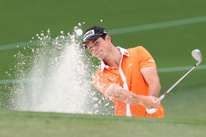 April 10, 2021, Augusta: Viktor Hovland hits out of the bunker on the second hole during the third round of the Masters at Augusta National Golf Club on Saturday, April 10, 2021, in Augusta. Curtis Compton/ccompton@ajc.com