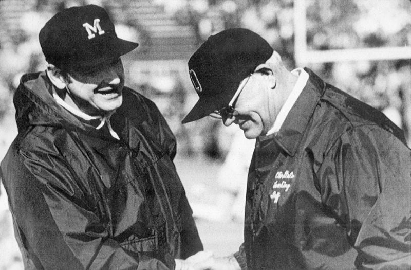 Michigan football coach Bo Schembechler, left, meets with Ohio State coach Woody Hayes in this undated photo, location unknown. Schembechler, the winningest coach in Michigan football history, died Friday, Nov. 17, 2006, after collapsing during the taping of a television show, according to three Detroit TV stations. He was 77. (AP Photo)