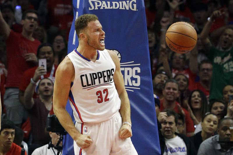 FILE - Los Angeles Clippers' Blake Griffin, right, reacts after making a dunk against Portland Trail Blazers' Mason Plumlee in the second half in Game 1 of a first-round NBA basketball playoff series, on Sunday, April 17, 2016, in Los Angeles. Griffin announced his retirement Tuesday, April 16, 2024, after a 14-year career that included six All-Star selections, Rookie of the Year honors and a dunk contest victory. (AP Photo/Jae C. Hong, File)