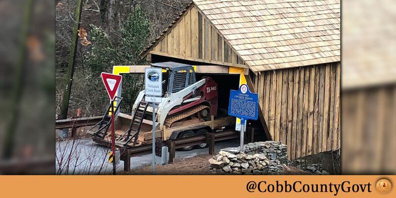 Vehicles collide with the Concord Road covered bridge (or with the barriers erected to protect the bridge) about once a month according to Cobb County. This collision occurred on Jan. 26. Photo: courtesy Cobb County