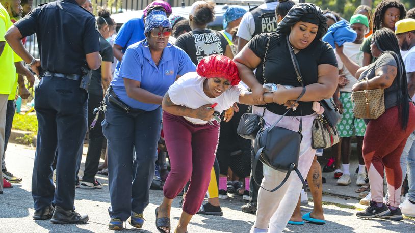 Friends and family members reacted to the news after an Atlanta mother was shot to death, Aug. 24,2021 during a domestic argument at a southeast Atlanta apartment complex. (John Spink / John.Spink@ajc.com)