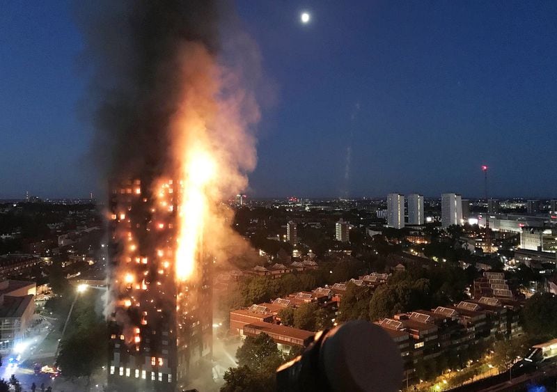  A deadly fire rages up the 24-story Grenfell Tower in a tragedy blamed on the building's exterior wall paneling. GURBUZ BINICI / GETTY IMAGES