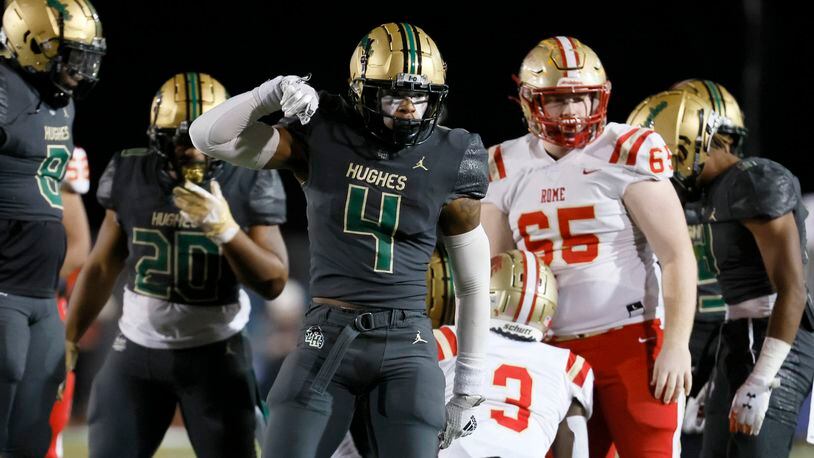 Langston Hughes linebacker Gannon Weathersby (4) reacts after making a tackle on Rome wide receiver Dekaylon Daniel (3) in the first of their Class 6A semi-final at Lakewood Stadium, Friday, December 2, 2022, in Atlanta. Jason Getz / Jason.Getz@ajc.com)