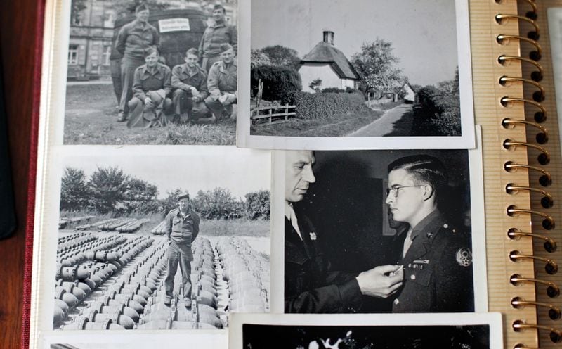 Old photographs of Eddie Sessions, including the photograph when he received his purple heart, (lower right), are shown at his home in Carrollton.