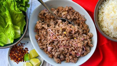 Laab-Style Pork has the critical tang of lime juice, funk of fish sauce and nuttiness of toasted rice powder. (Chris Hunt for The Atlanta Journal-Constitution)