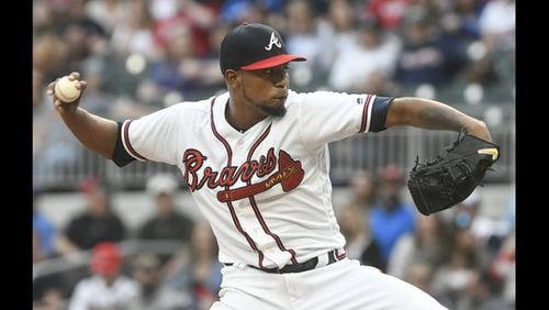 Julio Teheran fires a pitch in Saturday night’s win against the Mets. He worked seven scoreless innings to continue his career-long success against the Mets and reduce Braves’ starters ERA to 1.97 in the past 15 games. (AP Photo/John Amis)