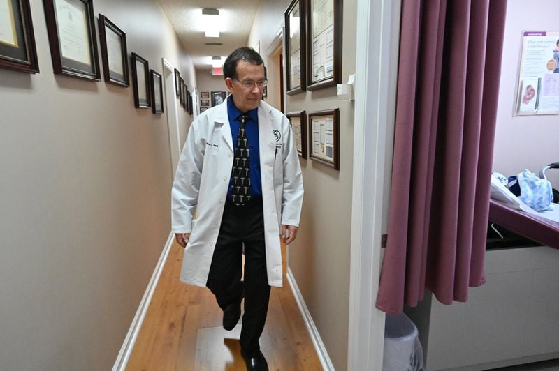 Dr. Jeffrey Harris enters a room where his patient Joy Holder visits with her 16-day-old son, Prince Jasper Lee Holder, on Feb. 6, 2020, at Wayne Obstetrics and Gynecology in Jesup in southeast Georgia. (Hyosub Shin / Hyosub.Shin@ajc.com)