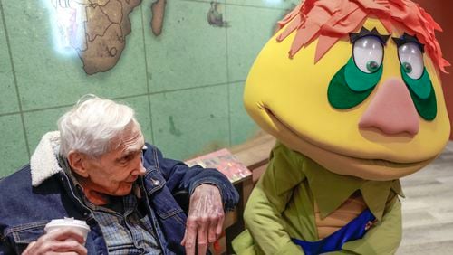 Children's television mogul Marty Krofft chats with H.R. Pufnstuf at the Center for Puppetry Arts in August. Krofft was in town to speak to audiences at Dragon Con. (Natrice Miller/ Natrice.miller@ajc.com)
