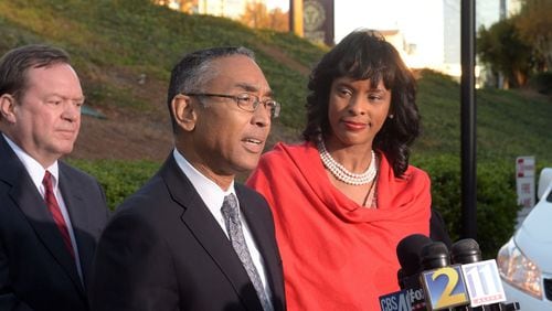 DeKalb CEO Burrell Ellis, with his wife Philippa, and defense attorney Craig Gillen, speaks during a press conference Thursday for the first time since he was convicted a year and a half ago following a second trial in DeKalb County. The Georgia Supreme Court threw out Ellis’ guilty verdicts on Wednesday. KENT D. JOHNSON/kdjohnson@ajc.com