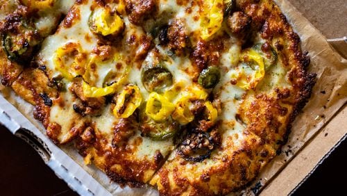 The authentic taste of the hot chicken pizza at Slim & Husky's lives up to the chain's Nashville roots. CONTRIBUTED BY HENRI HOLLIS