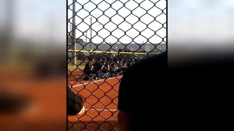 The Cedar Grove High School softball team took a knee during the national anthem. (Credit: Channel 2 Action News)
