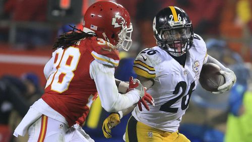 Pittsburgh Steelers running back Le'Veon Bell, right, runs from Kansas City Chiefs free safety Ron Parker (38) during the second half of an NFL divisional playoff football game Sunday, Jan. 15, 2017, in Kansas City, Mo. (AP Photo/Orlin Wagner)