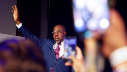 Sen. Raphael Warnock waves at supporters after winning the senate runoff election on Tuesday, December 6, 2022. (Natrice Miller/natrice.miller@ajc.com)  