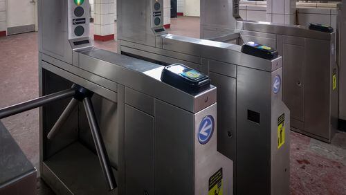 A transit turnstile in Chicago. Cubic Corp., which makes fare gates, back-office fare collection technology and other smart cities products for some of the world's largest mass transit agencies, is being acquired by two private equity firms in an all-cash deal valued at $2.8 billion. (Antwon McMullen/Dreamstime.com/TNS)