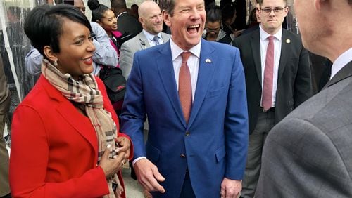 Atlanta Mayor Keisha Lance Bottoms, left, and Gov. Brian Kemp laugh with Norfolk Southern Chairman and CEO Jim Squires on Tuesday, March 26, 2019, before a groundbreaking ceremony for the railroad giant’s new Midtown Atlanta headquarters. J. SCOTT TRUBEY/STRUBEY@AJC.COM