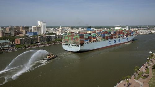 The container ship COSCO Development sails up river past the historic district of Savannah, Ga., to the Port of Savannah, on Thursday, May 11, 2017. At 1,201 feet long and 158 feet wide, the ship was at the time the largest vessel ever to call on the U.S. East Coast. (AP Photo/Georgia Ports Authority, Stephen Morton)