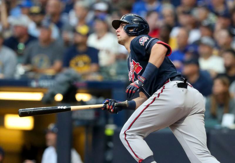 Braves third baseman Austin Riley (27) hits a solo homer in the six inning of Game 2 of the NLDS agaist the Milwaukee Brewers Saturday, Oct. 9, 2021, in Milwaukee.  (Curtis Compton / Curtis.Compton@ajc.com)